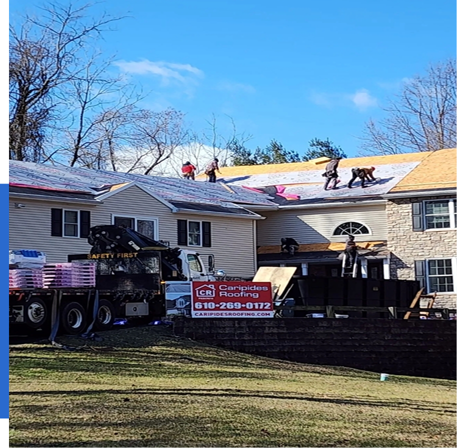 Group 71 Roofers working on a residential building roof.