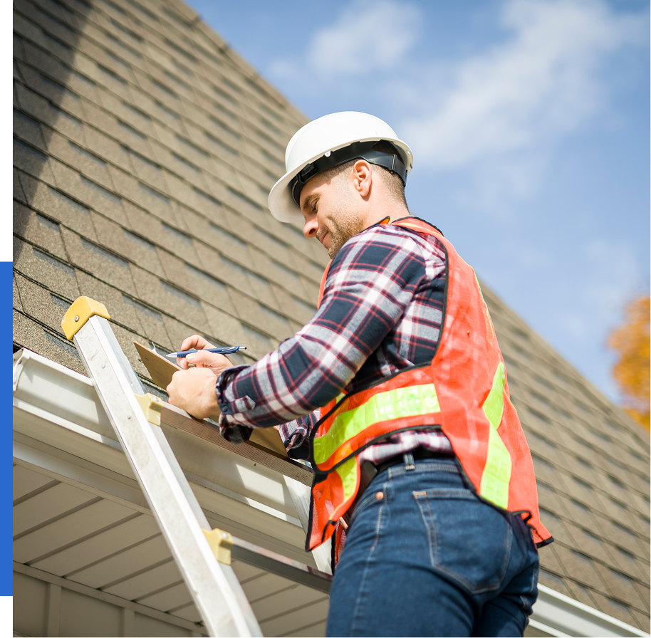Group 71 (4) Worker inspecting roof wearing safety gear.