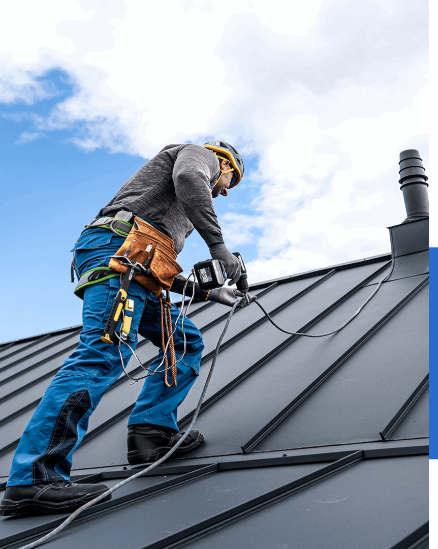 Group 73 (4) Worker installing solar panels on roof.